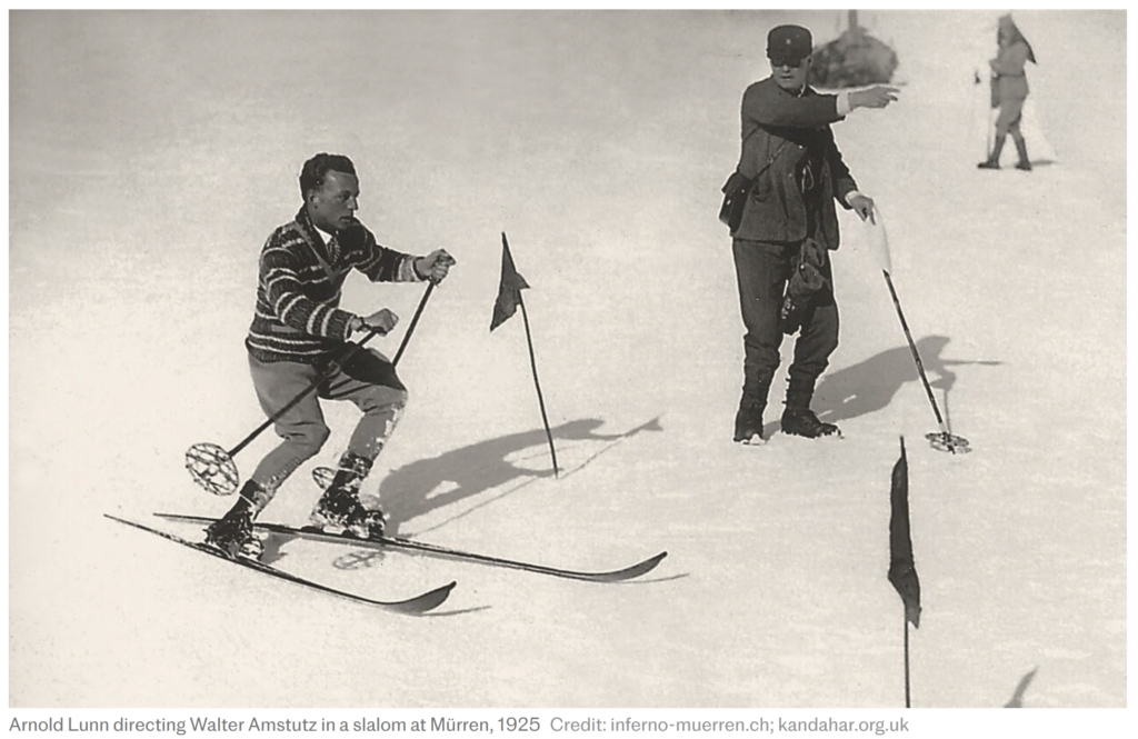 Arnold Lunn directing Walter Amstutz round a slalom course in 1925. The modern slalom was invented by Lunn.