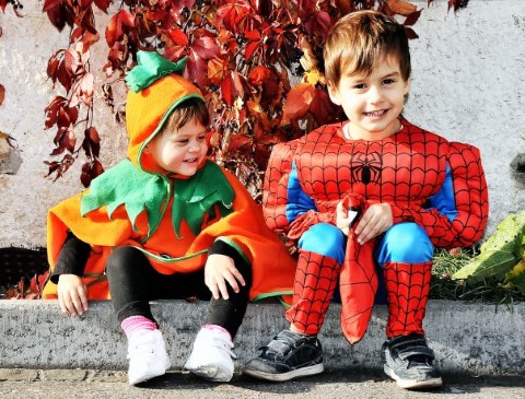Kids wearing Halloween costumes